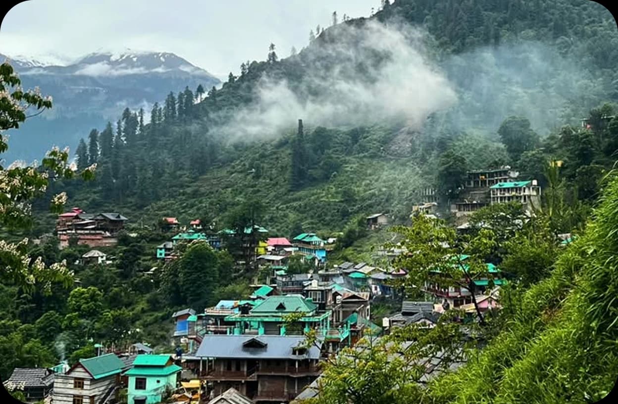 A mountain village surrounded by green hills